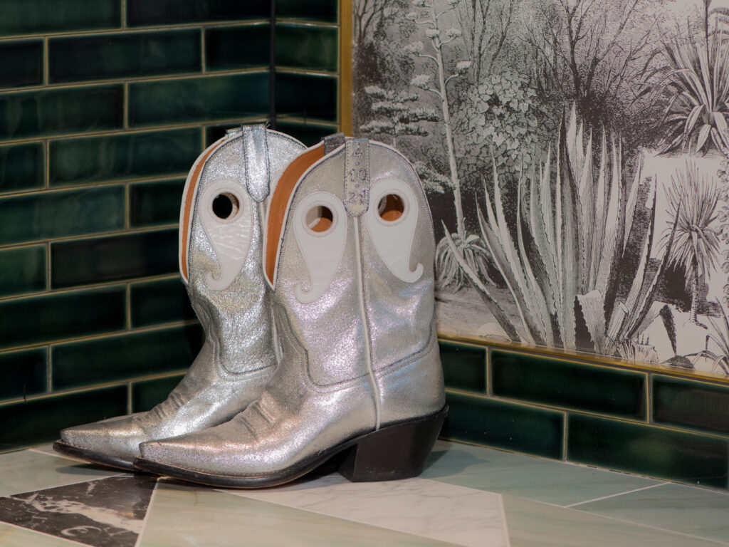 Silver cowboy boots in the corner of Hotel Swexan